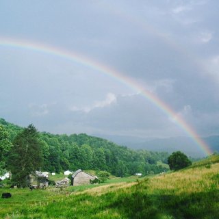 double rainbow over a farm