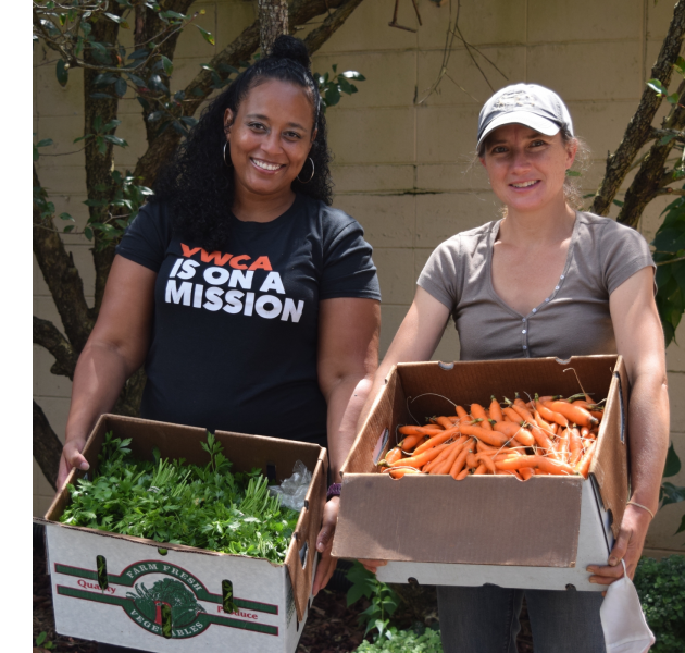 Melinda Aponte of the YWCA, left, with Anna Littman of Ivy Creek Family Farm