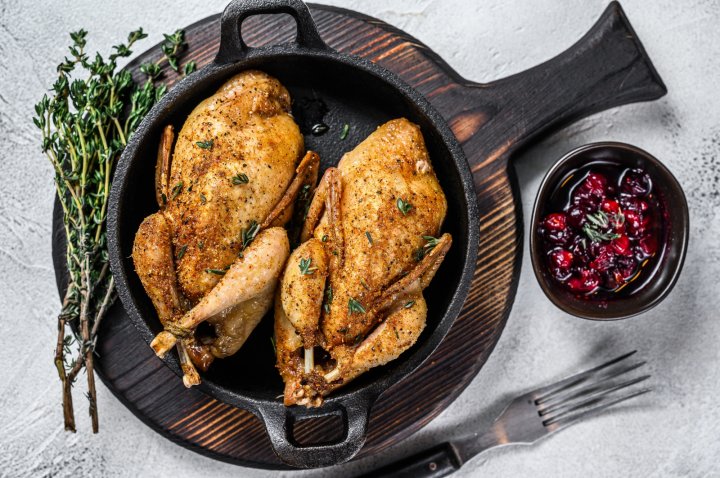 roasted quail with herbs and cranberry sauce