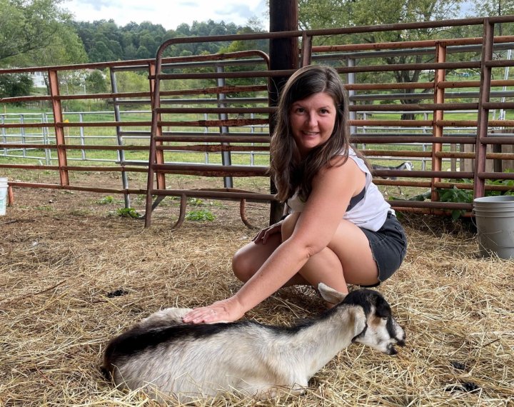 petting a goat at Mount Gilead Farm on ASAP's Farm Tour