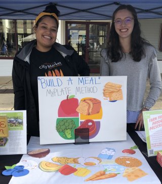 ASAP staff and volunteer doing a nutrition activity