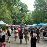 Lisa Payne and Stacy Dean in front of Growing Minds Meet Your Farmer banners at Weaverville Primary