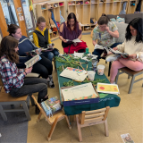 Teachers gather in a half circle in a classroom