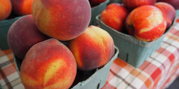 peaches on plaid table cloth