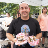 Mike Bean of Finest Deli with sandwich