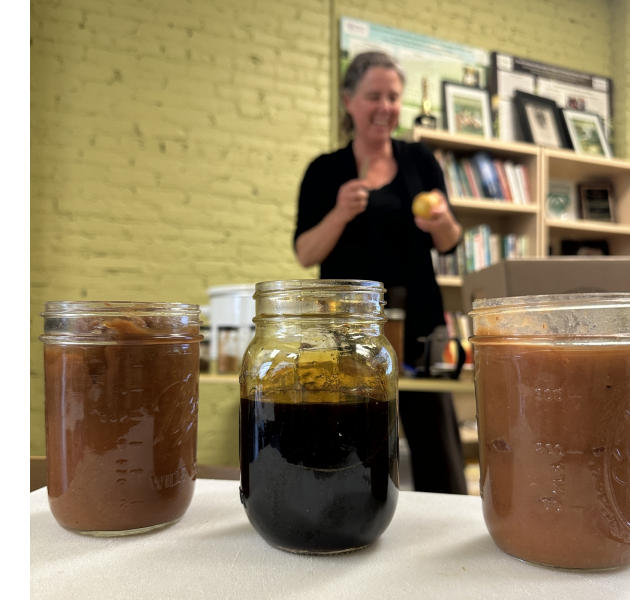 Molly Nicholie demonstrating apple butter production